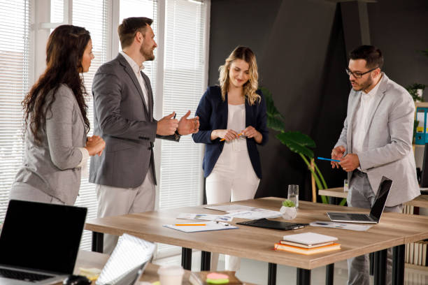 istock Four entrepreneurs discussing business during a meeting 1333814023