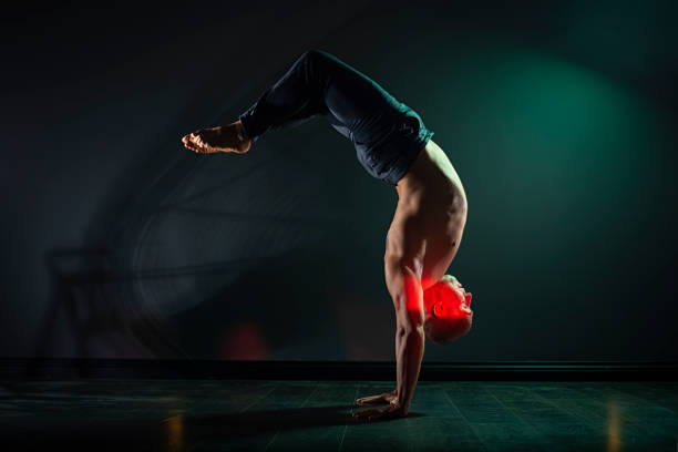 istock Capoeira artist posing with handstand in studio. 1333814569