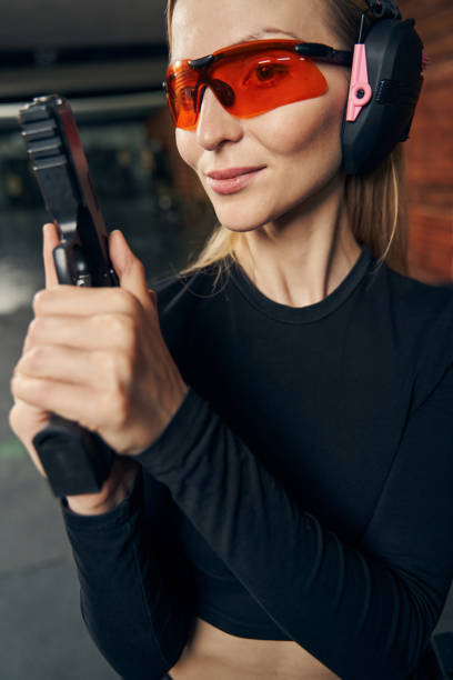 istock Calm woman with a firearm looking ahead 1333814661
