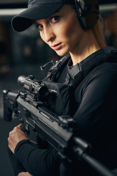 istock Female shooter in a cap looking ahead 1333814712