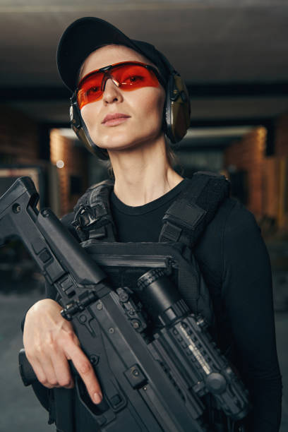 istock Attractive woman with a firearm posing for the camera 1333814713