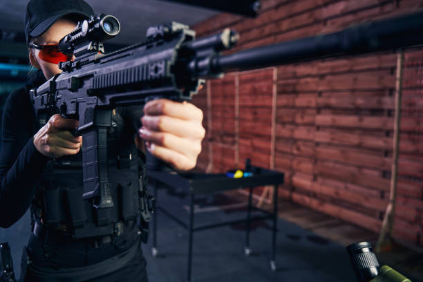 istock Concentrated professional shooter using a telescopic sight for target shooting 1333814727
