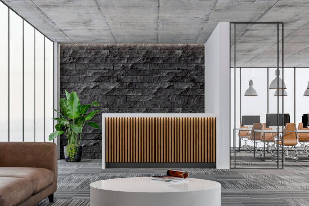 istock Large office interior: a reception desk, a lounge corner with copy space and wordesks behind glass door 1333816158