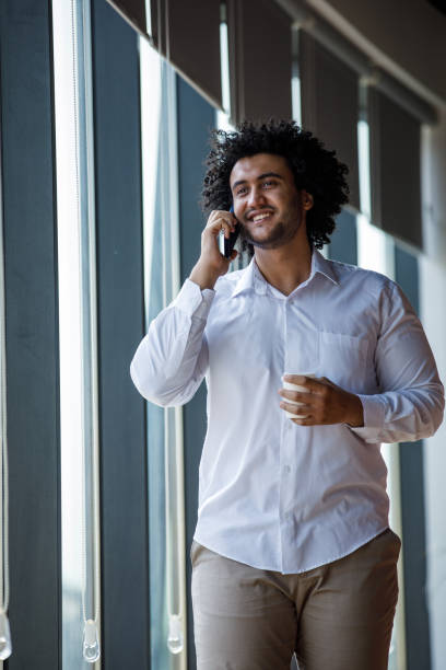 istock Businessman having coffee during a conference call 1333817120