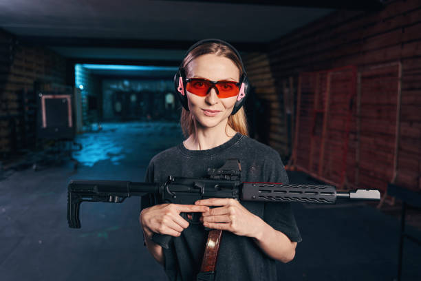 istock Serene lady holding a rifle with a telescopic sight 1333817492