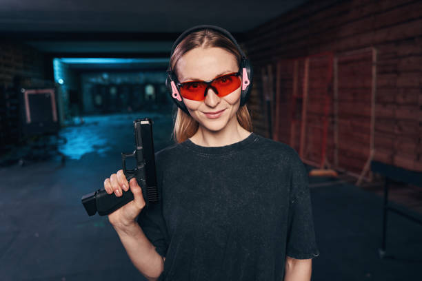 istock Confident female shooter in safety goggles looking ahead 1333817498