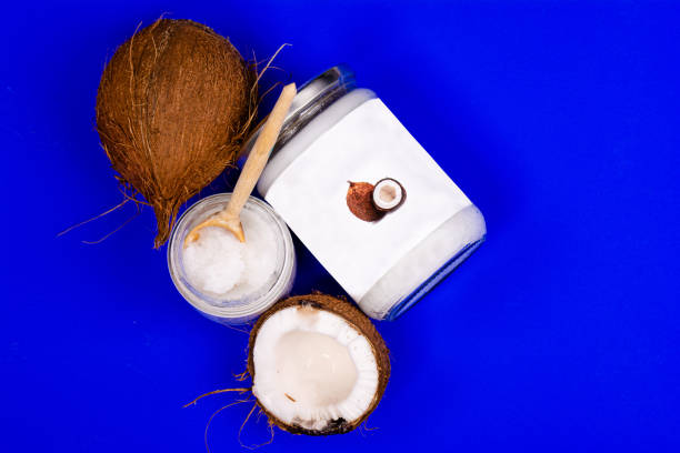 istock coconut oil and fresh coconuts, on a blue background 1333818810