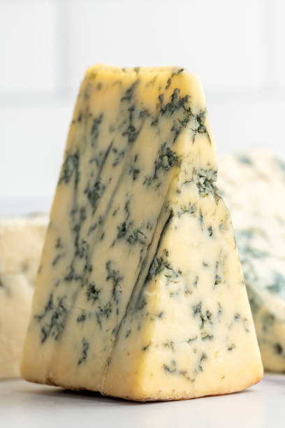 istock Pieces of Stilton Cheese over a kitchen counter 1333818943