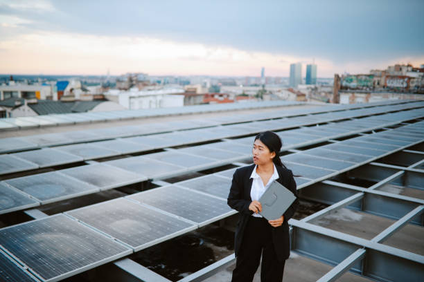 istock Science person inspecting solar panels on the city rooftop 1333818997