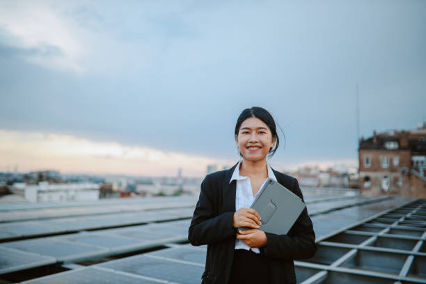 istock Science person inspecting solar panels on the city rooftop 1333819683