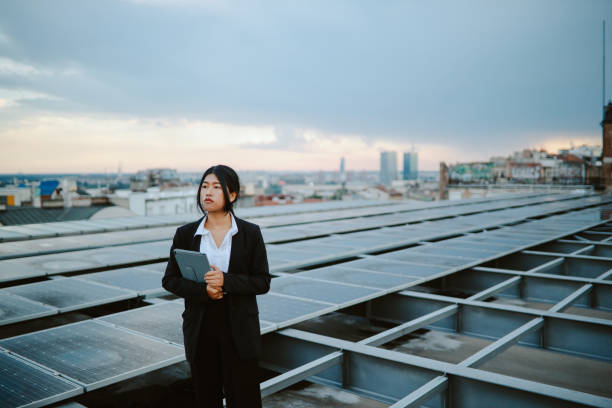 istock Science person inspecting solar panels on the city rooftop 1333819713