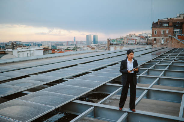 istock Science person inspecting solar panels on the city rooftop 1333819737