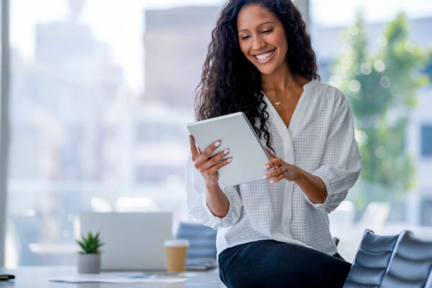 istock Young business woman using a digital tablet. 1333820977