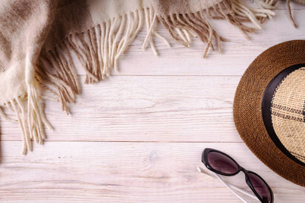 istock sunglasses hat plaid on wooden background 1333821255