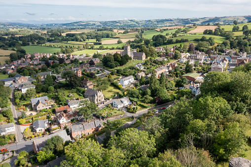 Aerial drone point of view, of the small town of Montgomery in Powys, Wales. Located about a mile from the English border, the town was established in the early 13th century, when nearby Montgomery castle was built as a fortified defence, with its high crag vantage point that looked out across the nearby countryside and English Welsh border.