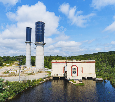 An aerial view of a hydro electric power station & water storage towers.