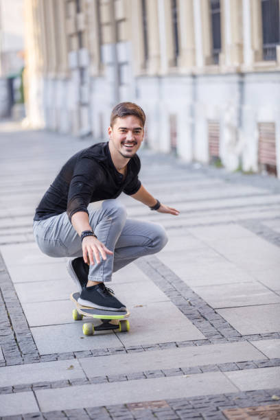 istock A Young Man is Enjoying Vacation While Riding a Skateboard in the City and Exploring. 1333829003