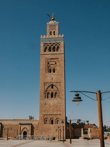 Front view of Kutubiyya Mosque located in Marrakesh, Morocco. Concept of travel and tourism.