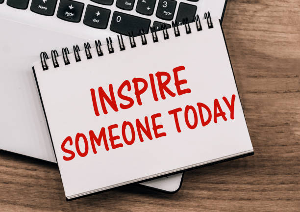 istock Inspire Someone Today - inscription on notepad on laptop keyboard 1333838902