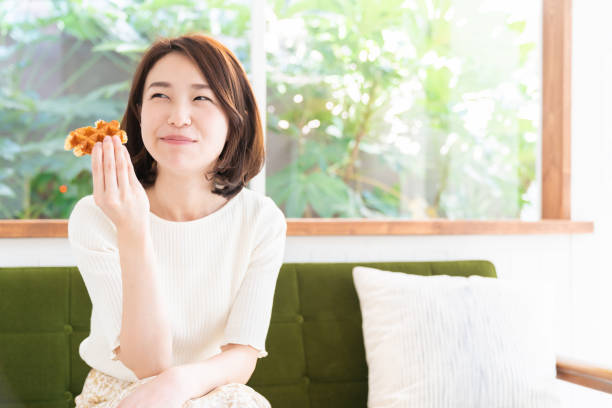 istock attractive asian woman who eats 1333846008