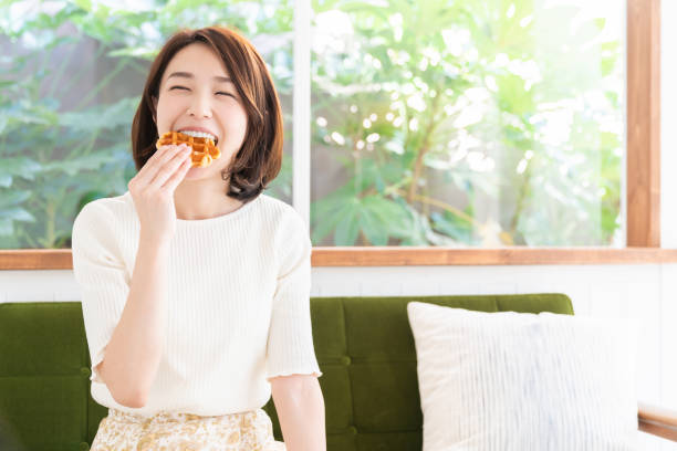 istock attractive asian woman who eats 1333846015