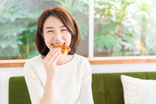 istock attractive asian woman who eats 1333846037