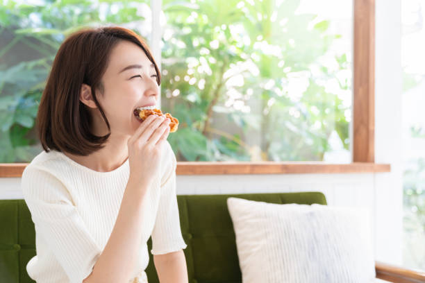 istock attractive asian woman who eats 1333846052