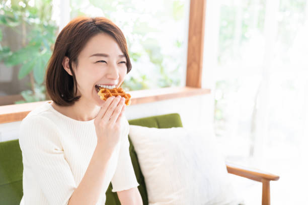 istock attractive asian woman who eats 1333846060