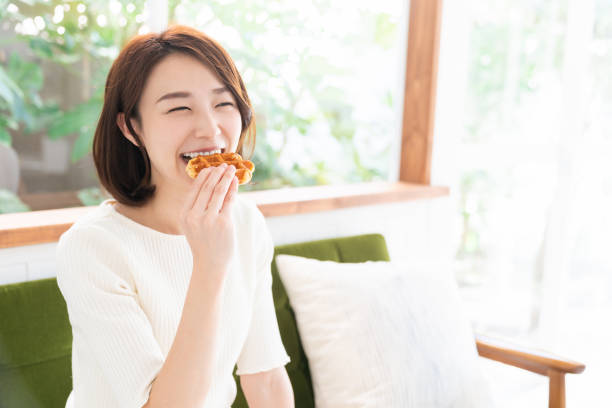 istock attractive asian woman who eats 1333846071