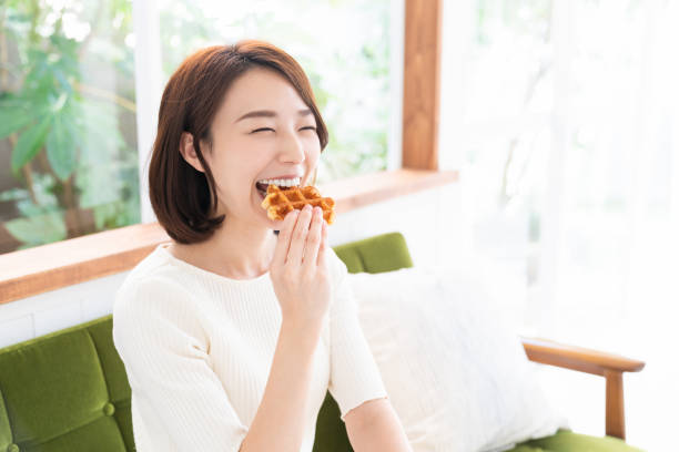 istock attractive asian woman who eats 1333846098