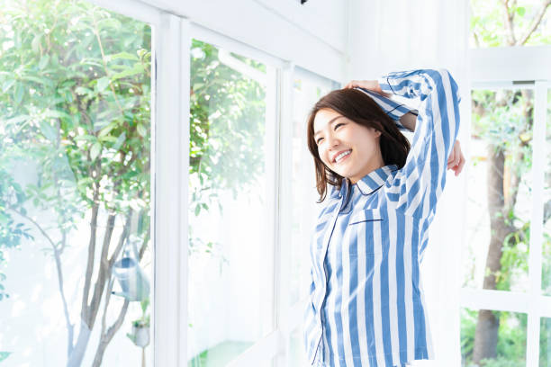 asian woman in night clothes stock photo