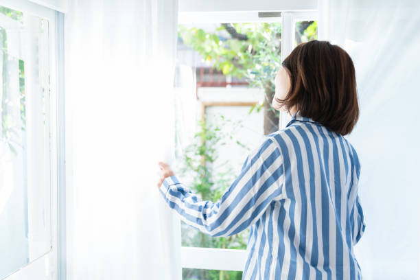 istock asian woman in night clothes,Back view 1333846108