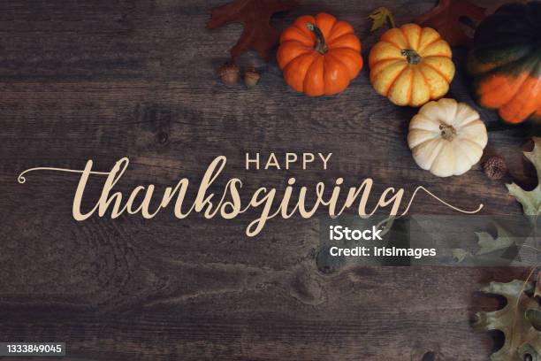 Happy Thanksgiving Holiday Greeting Card Calligraphy Text Design With Fall Pumpkins Squash And Leaves Over Wood Table Background Stock Photo - Download Image Now