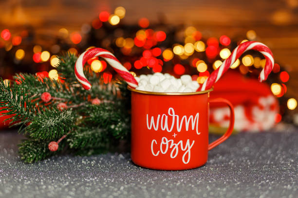 istock Christmas drink. Cup of hot chocolate with marshmallows and candy cane 1333851978
