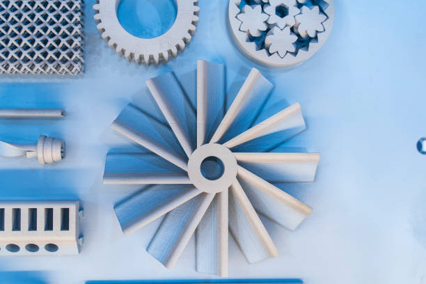 Gears of various sizes. Transmission gears of a car lined up side by side. Gray background. No people.