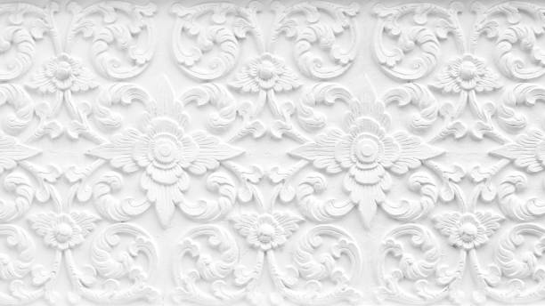 istock Pattern of flower carved on cement wall background 1333855915