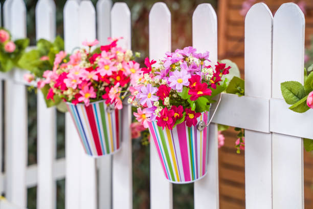 istock Hanging Flower Pots with fence 1333856031
