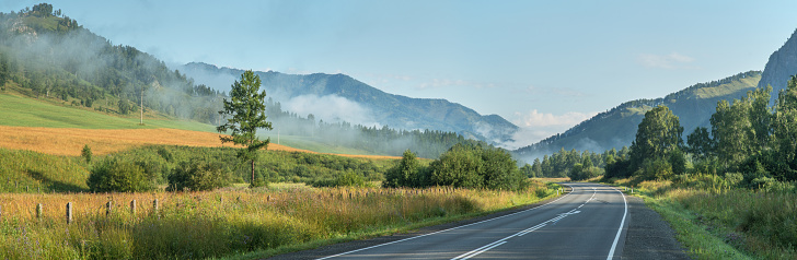Chuysky tract - a picturesque road in the Altai mountains, Russia. Panoramic view, morning light.