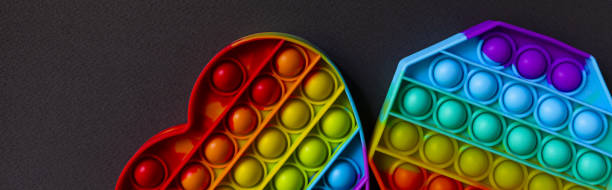 istock Colorful antistress sensory toy fidget push pop it on black background 1333862445