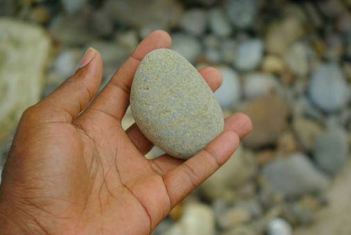 beach pebble in open hand