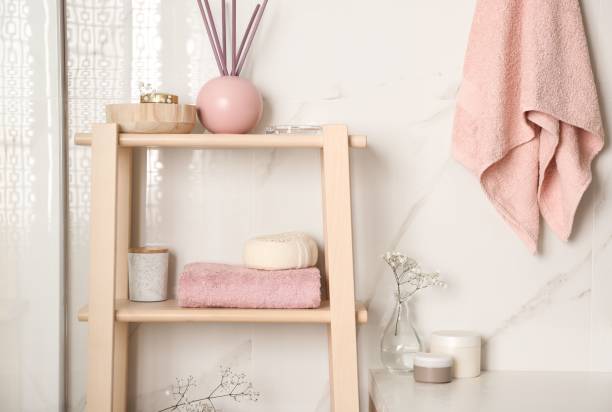 istock Shelving unit with towel and decorative elements in bathroom interior 1333872251