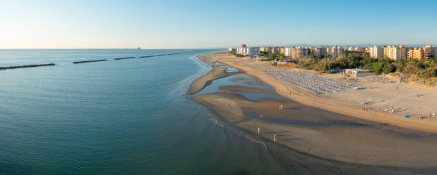 istock Drone view of sandy beach with umbrellas and gazebos 1333876517
