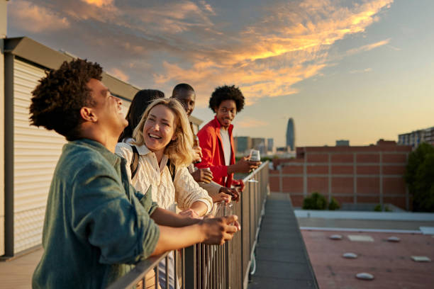 istock Friends Laughing and Talking on Office Rooftop After Work 1333877343