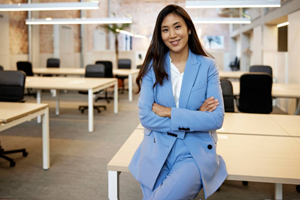 office portrait of confident mid 30s korean businesswoman - fato de senhora imagens e fotografias de stock