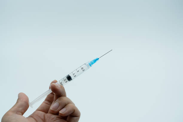 Image of using  drugs with a syringe Image of using  drugs with a syringe b117 covid 19 variant photos stock pictures, royalty-free photos & images