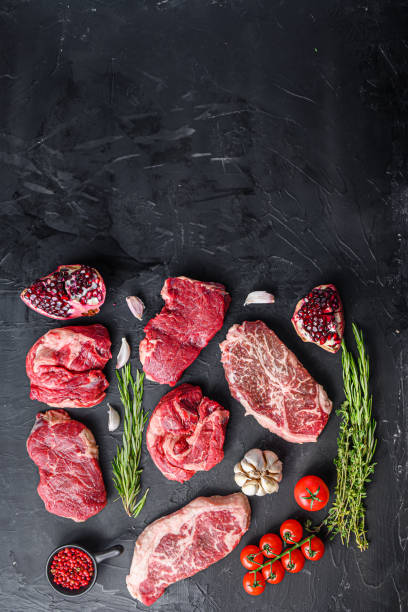 istock Set of various alternative raw meat steaks  over black background top view. With space for text. 1333881720