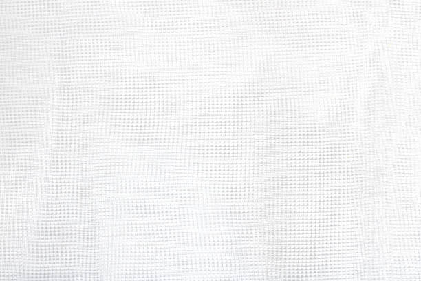 istock White mesh texture. Fabric for sewing, decoration or household needs. Square shape. Grid 1333881817