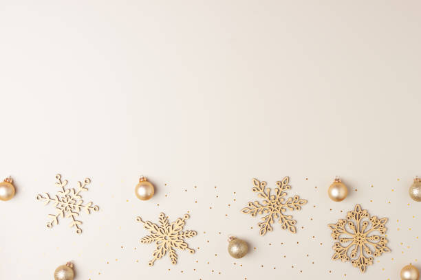 istock Christmas beige minimal background with snowflakes. Flat lay, copy space 1333885102