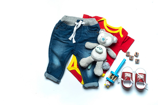 Baby boy clothes and accessories collection for a cool newborn baby outfit with no people included