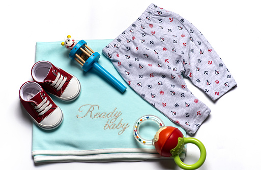 Baby boy clothes and accessories collection for a cool newborn baby outfit with no people included